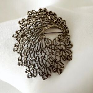Vintage Monet Brooch in silver Tone filigree